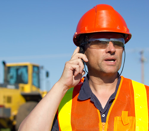 Construction worker on cellphone