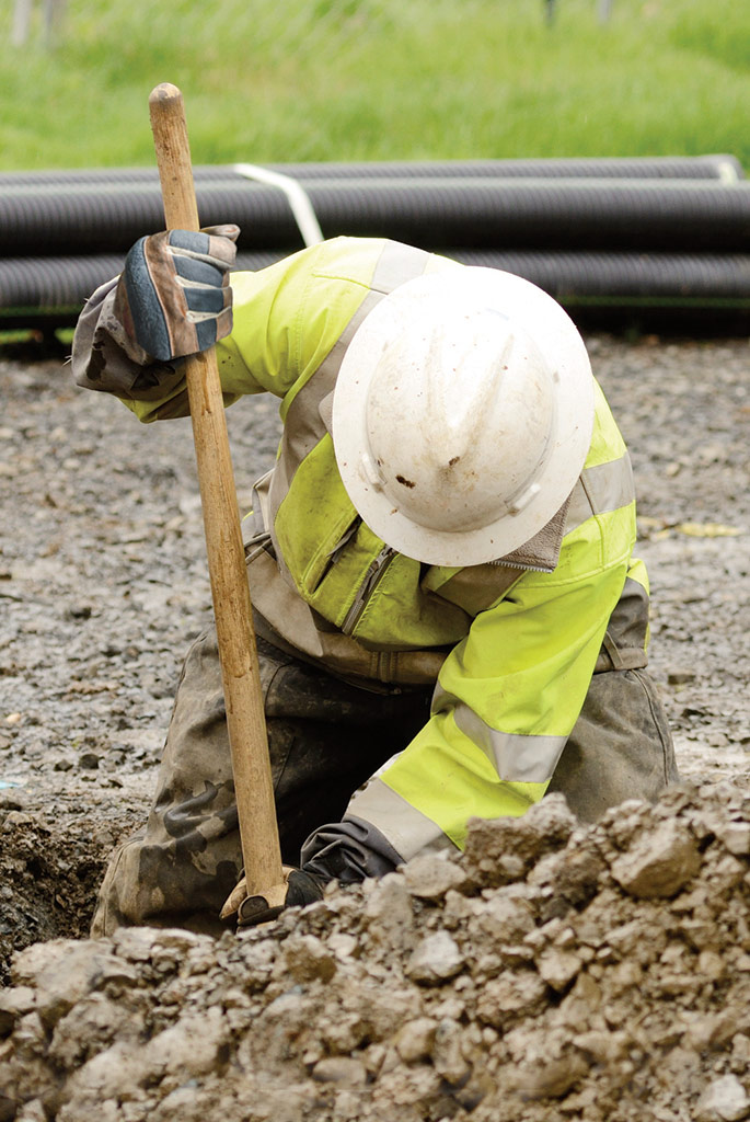 Contractor hand digging